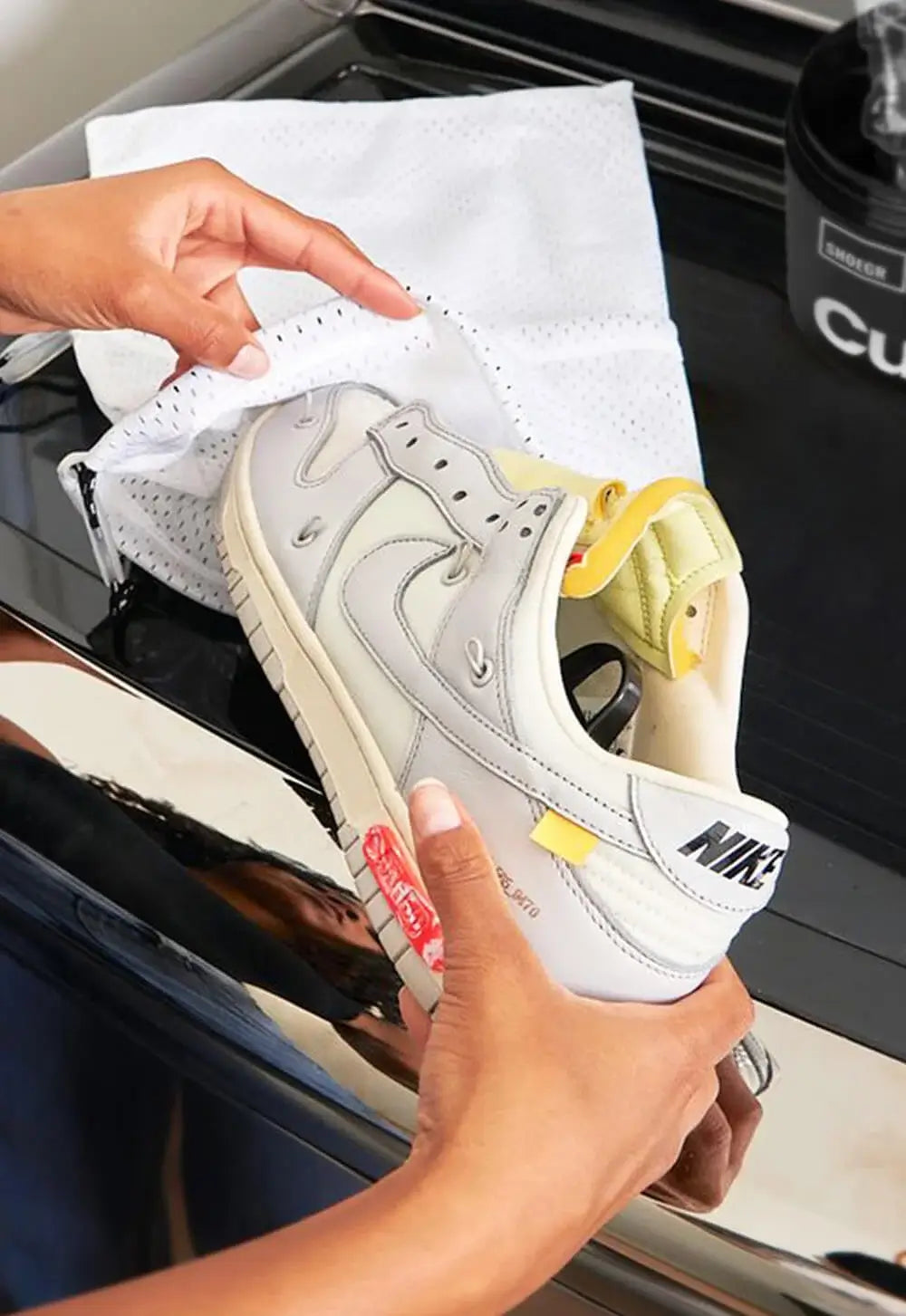 putting shoe in mesh polyester bag machine washing sneakers